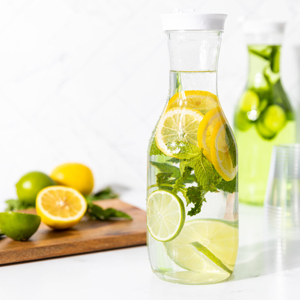 Pitcher With White Lid 50 oz filled with citrus infused water - The Closeout Connection