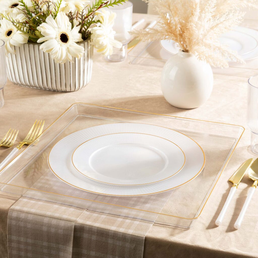 Linear Collection pearl plates with gold rim on a set table