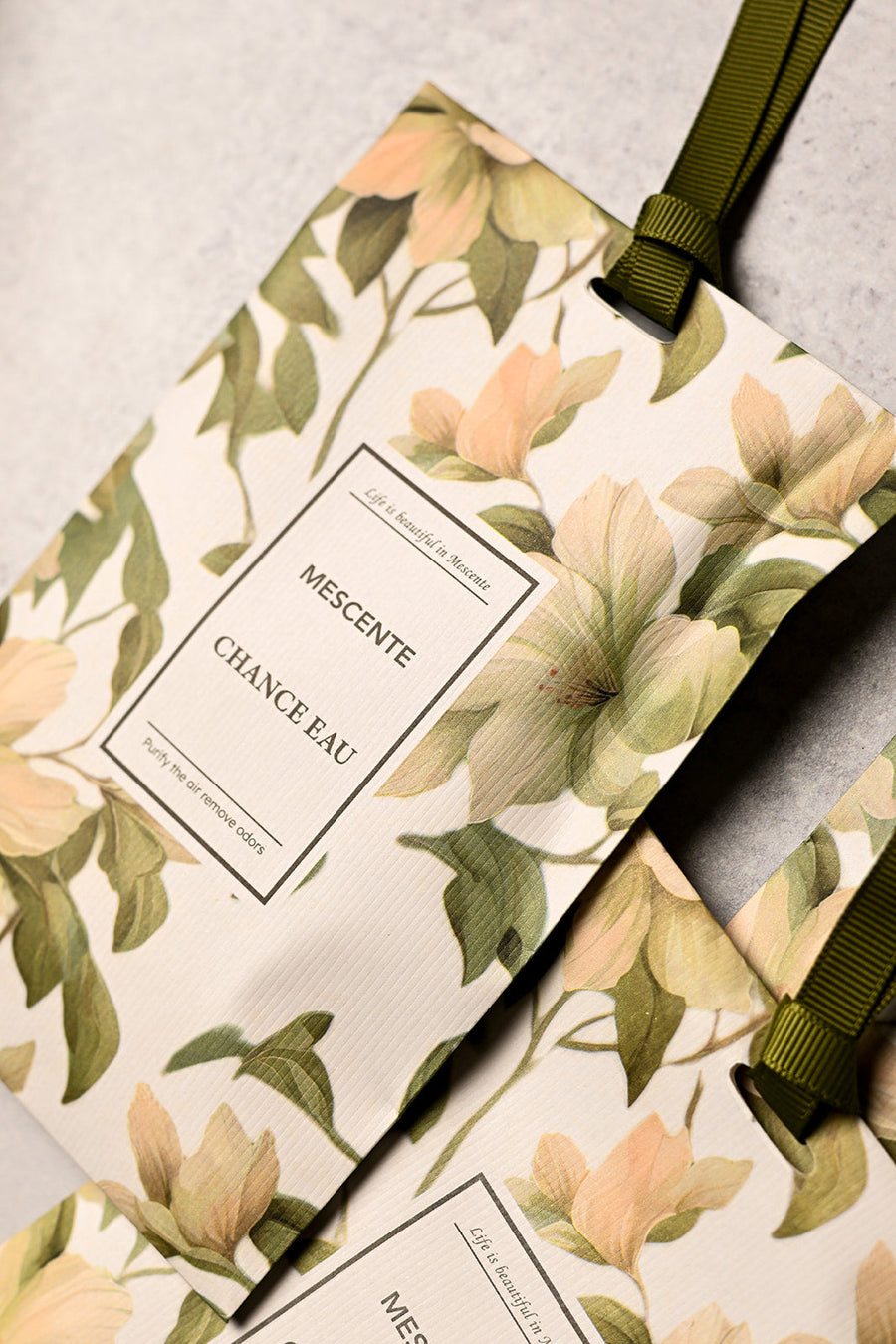 Mescente Chance Eau scented sachet close up with green ribbon