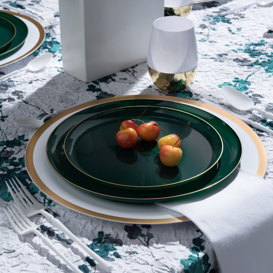 Decor Edge Collection green plates with gold rim on a set table