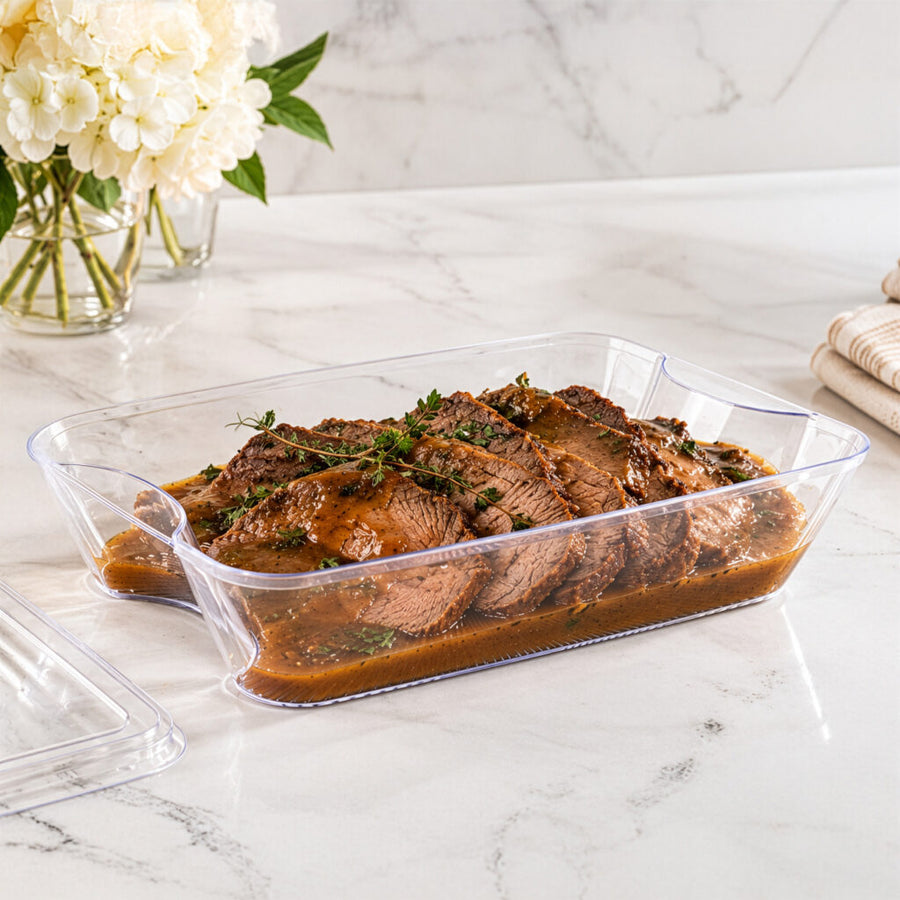 Clear deep 107 oz tray with roast on a marble counter