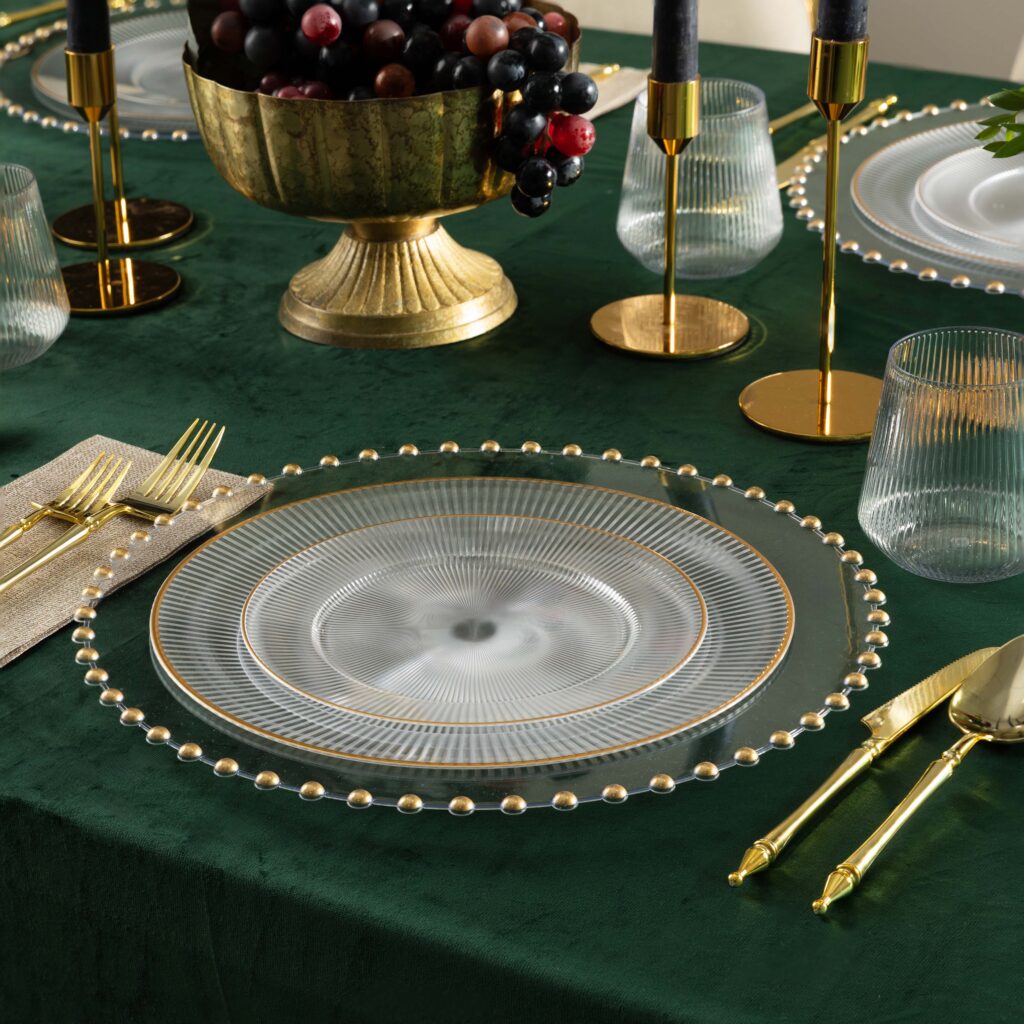Linear Collection clear plates with gold rim on a green velvet table#Color_Clear-Gold